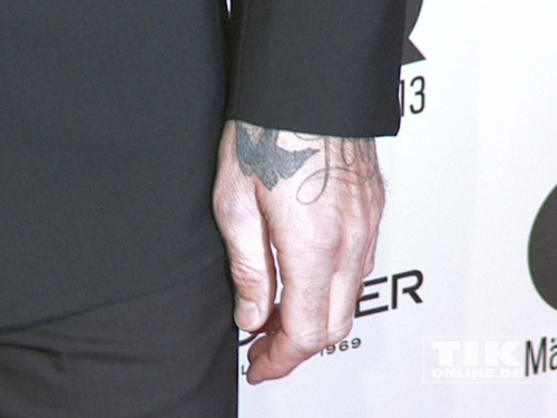David Beckham lässt ein Tattoo blitzen
